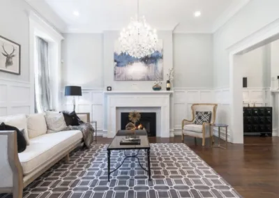 A living room with hardwood floors and a fireplace.